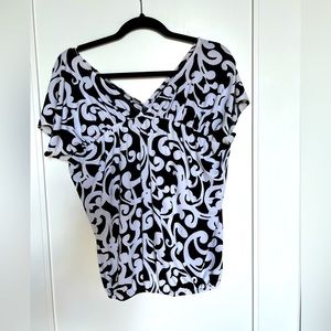Black and white loosely fitting top.